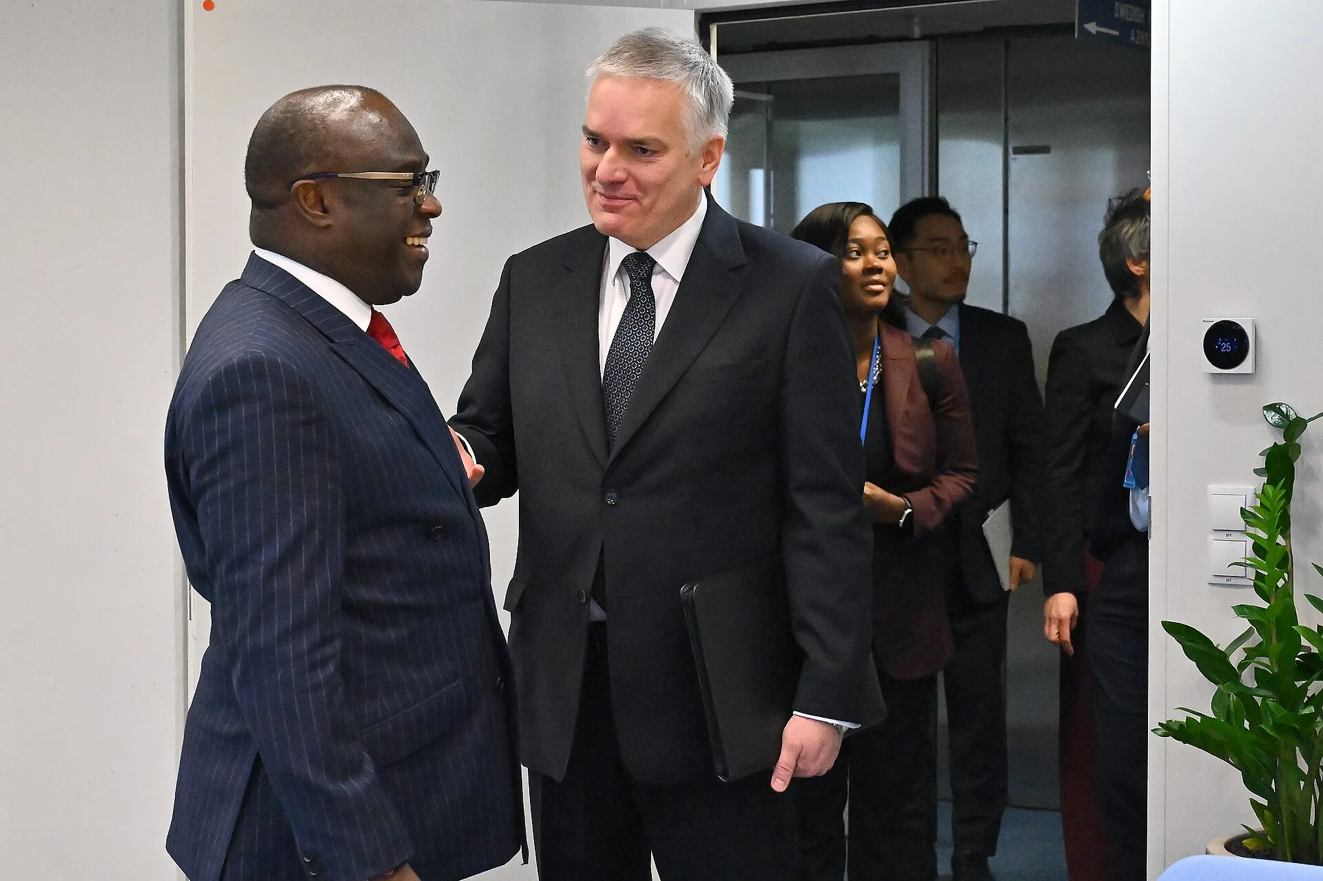 Jacek Bylica, IAEA Chief of Cabinet, welcomes Ambassador Harold Adlai Agyeman, Ambassador and Permanent Representative to the United Nations and Chair-Designate, 3rd NPT Prep Com, and his delegation upon their arrival to the Agency headquarters in Vienna, Austria. 15 January 2025. Photo Credit: Dean